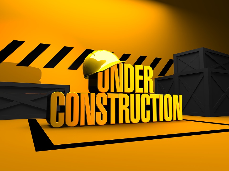 under construction sign with hard hat